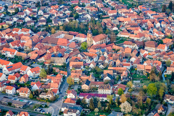Mühlgasse to the parish church of St. Michael in Rheinzabern in the state Rhineland-Palatinate, Germany