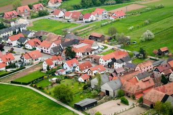Aerial view of Village - view on the edge of agricultural fields and farmland in Hergersweiler in the state Rhineland-Palatinate