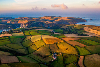 Fields before marine coastal area of Dartmouth in England, United Kingdom