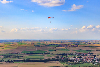 Paragliding over village in Ebertsheim in the state Rhineland-Palatinate, Germany