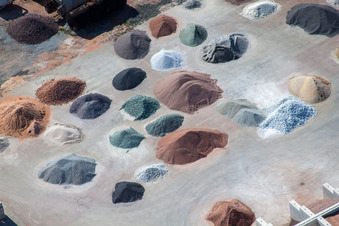 Piles of coloured gravel in the depot of Badische Terrazzo Handelsgesellschaft mbH in the district Neudorf in Graben-Neudorf in the state Baden-Wurttemberg