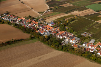 Oblique view of Village - view on the edge of agricultural fields and farmland in Vollmersweiler in the state Rhineland-Palatinate