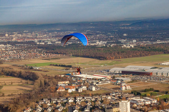 Paraglider in front of the DM Arena in the district Forchheim in Rheinstetten in the state Baden-Wuerttemberg, Germany
