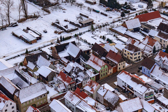 Drone recording of Saarstraße in winter with snow in Kandel in the state Rhineland-Palatinate, Germany