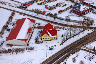 Oblique view of Gockelwirt in winter when there is snow in Minfeld in the state Rhineland-Palatinate, Germany