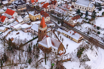 Aerial photograpy of Protest. Church in winter with snow in Minfeld in the state Rhineland-Palatinate, Germany