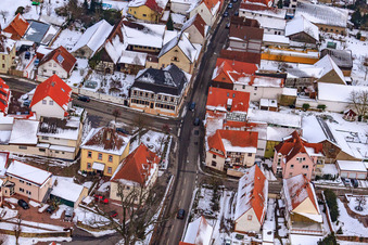 Herrengasse in winter with snow in Minfeld in the state Rhineland-Palatinate, Germany