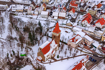 Protest. Church in winter with snow in Minfeld in the state Rhineland-Palatinate, Germany from above