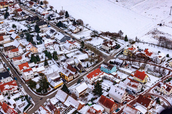 Aerial view of Herrengasse in winter with snow in Minfeld in the state Rhineland-Palatinate, Germany