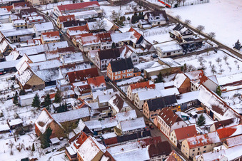 Aerial view of Main street in snow in Freckenfeld in the state Rhineland-Palatinate, Germany