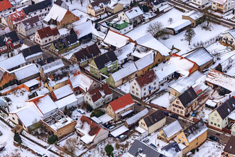 Main street in snow in Freckenfeld in the state Rhineland-Palatinate, Germany from above