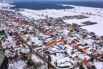 Kirchstraße in the snow in Freckenfeld in the state Rhineland-Palatinate, Germany