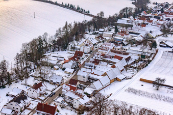 Aerial view of Main street in snow in Vollmersweiler in the state Rhineland-Palatinate, Germany