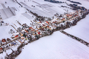 Main street in snow in Vollmersweiler in the state Rhineland-Palatinate, Germany out of the air