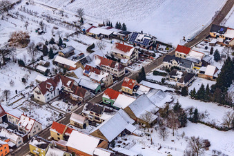 Main street in winter in the snow in the district Kleinsteinfeld in Niederotterbach in the state Rhineland-Palatinate, Germany