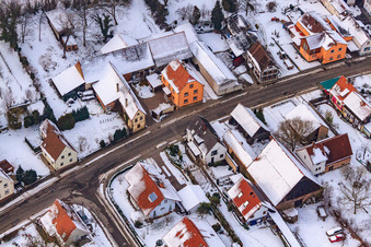 Aerial photograpy of Main street in winter in the snow in the district Kleinsteinfeld in Niederotterbach in the state Rhineland-Palatinate, Germany