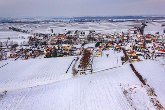 Village view from the south in winter in the snow in Dierbach in the state Rhineland-Palatinate, Germany