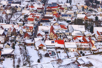 Main street in winter in the snow in Dierbach in the state Rhineland-Palatinate, Germany