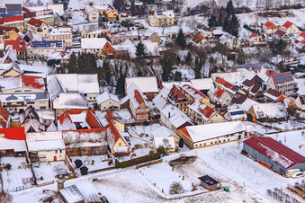 Aerial view of Main street in winter in the snow in Dierbach in the state Rhineland-Palatinate, Germany