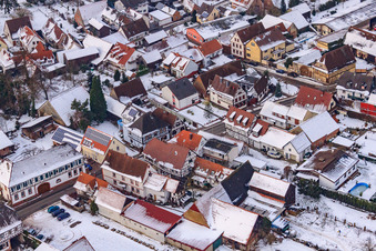 Main street in winter in the snow in Barbelroth in the state Rhineland-Palatinate, Germany