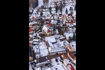 Church in the snow in Barbelroth in the state Rhineland-Palatinate, Germany from above