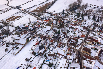 Oblique view of Main street in winter in the snow in Barbelroth in the state Rhineland-Palatinate, Germany