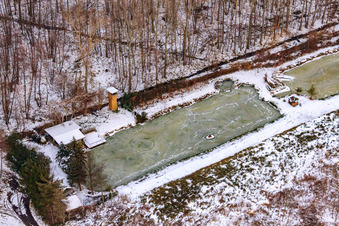 Fish ponds in the snow in Barbelroth in the state Rhineland-Palatinate, Germany
