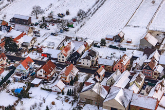 Aerial view of Main street in winter in the snow in Hergersweiler in the state Rhineland-Palatinate, Germany