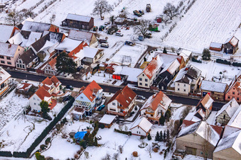 Aerial photograpy of Main street in winter in the snow in Hergersweiler in the state Rhineland-Palatinate, Germany