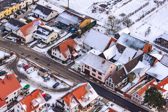 Oblique view of Main street in winter in the snow in Hergersweiler in the state Rhineland-Palatinate, Germany