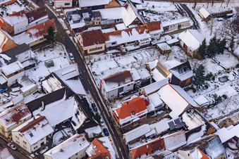 Aerial view of Raiffeisenstraße in the snow in Winden in the state Rhineland-Palatinate, Germany