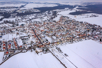 View of the town from the southwest in snow in Steinweiler in the state Rhineland-Palatinate, Germany
