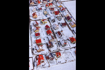 Oblique view of New development area Brotäcker in snow in Steinweiler in the state Rhineland-Palatinate, Germany