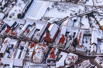 Oblique view of Kreuzgasse in the snow in Steinweiler in the state Rhineland-Palatinate, Germany