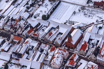 Kreuzgasse in the snow in Steinweiler in the state Rhineland-Palatinate, Germany from above