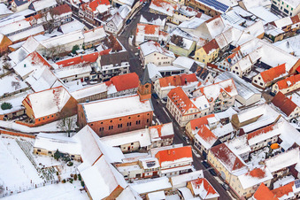 Protest. Church in the snow in Steinweiler in the state Rhineland-Palatinate, Germany from above