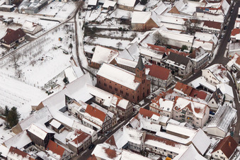 Wintry snowy Evangelic Church building in the village of in Steinweiler in the state Rhineland-Palatinate, Germany
