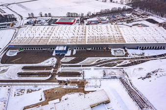 Aerial view of Im Horst industrial estate, logistics center in snow in the district Minderslachen in Kandel in the state Rhineland-Palatinate, Germany