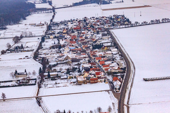 Village view from the west in snow in the district Minderslachen in Kandel in the state Rhineland-Palatinate, Germany
