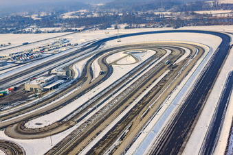 Oberwald industrial area, Daimler truck test track in winter with snow in Wörth am Rhein in the state Rhineland-Palatinate, Germany from the plane
