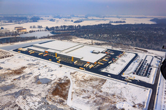 Aerial view of Oberwald industrial area, Netto logistics center in winter with snow in Wörth am Rhein in the state Rhineland-Palatinate, Germany