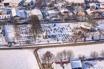Cemetery in winter with snow in Neupotz in the state Rhineland-Palatinate, Germany