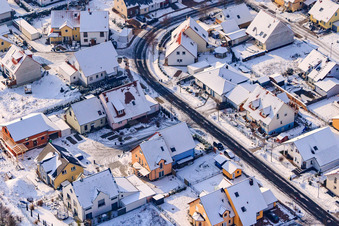Aerial photograpy of Raiffeisenstraße in winter with snow in Rheinzabern in the state Rhineland-Palatinate, Germany