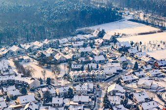 At clay pits in winter with snow in Rheinzabern in the state Rhineland-Palatinate, Germany from above