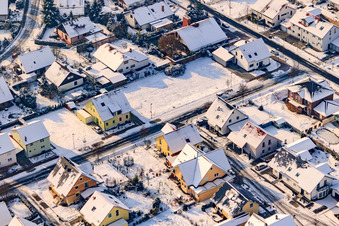 Raiffeisenstraße in winter with snow in Rheinzabern in the state Rhineland-Palatinate, Germany from above