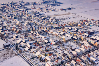 Pfarrer-Frey-Straße in winter with snow in Hatzenbühl in the state Rhineland-Palatinate, Germany