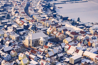 Church of St. Wendelin in winter with snow in Hatzenbühl in the state Rhineland-Palatinate, Germany