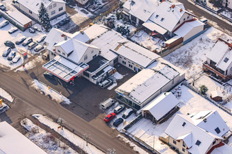 Gas station in winter with snow in Hatzenbühl in the state Rhineland-Palatinate, Germany