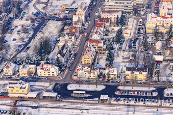 Parking at the train station in winter when there is snow in Kandel in the state Rhineland-Palatinate, Germany