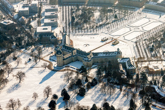 Wintry snowy Building complex in the park of the castle Schloss Karlsruhe in Karlsruhe in the state Baden-Wurttemberg, Germany
